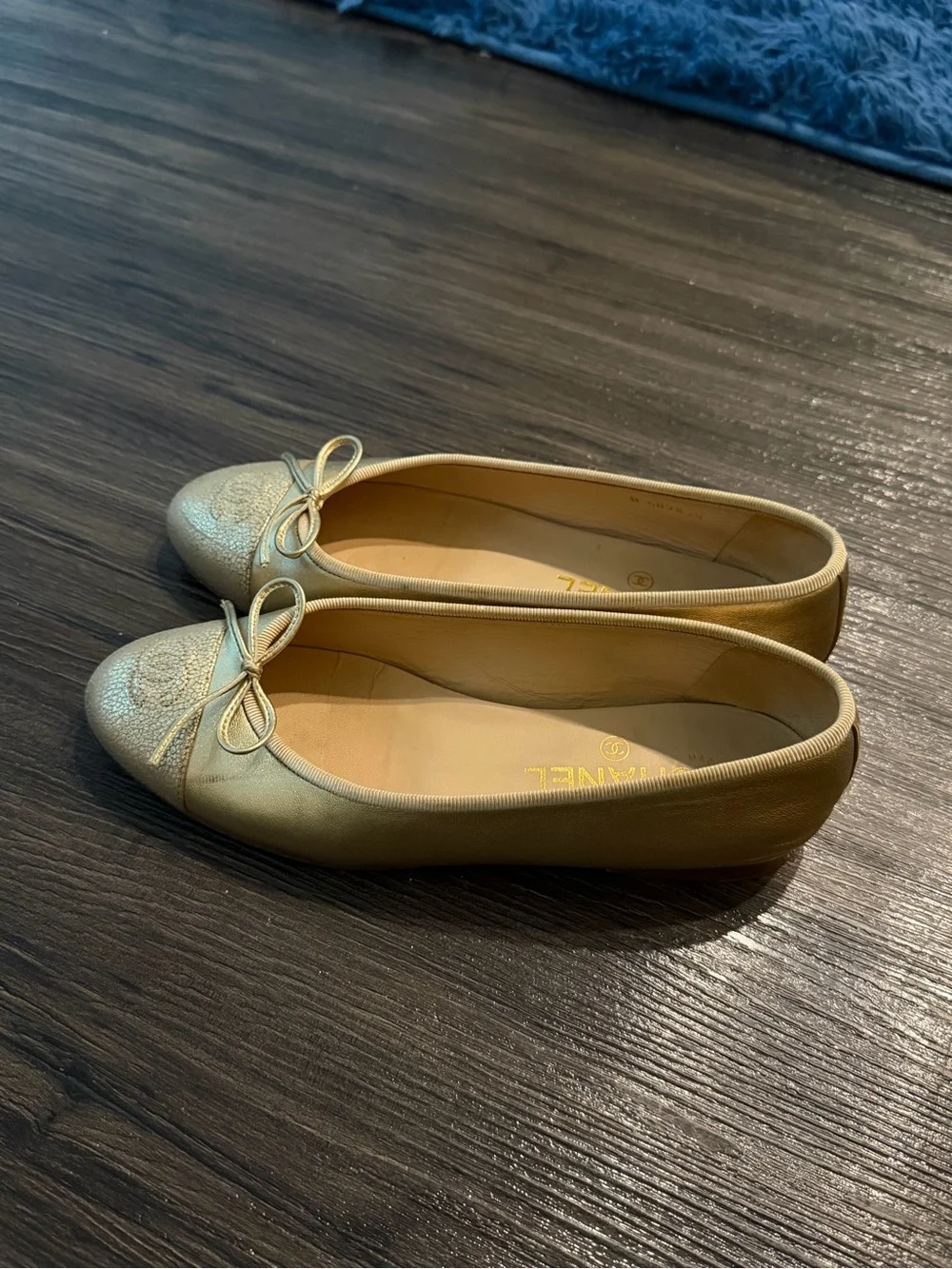 CHANEL Metallic Gold Leather Ballet Flats with Bow Accent